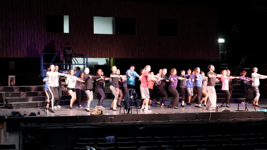The ensemble rehearses for opening night. 