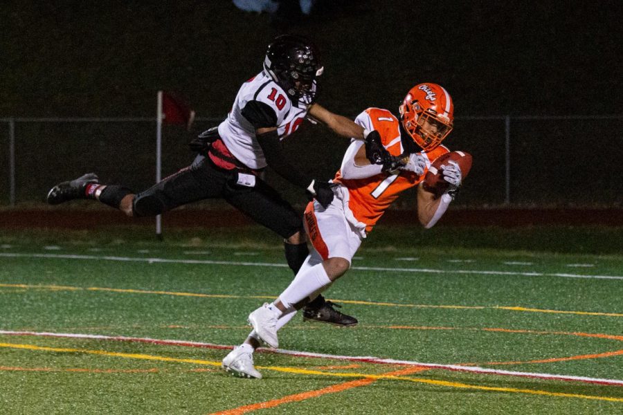 Mark Phillips catches the ball against a Kingsway defender