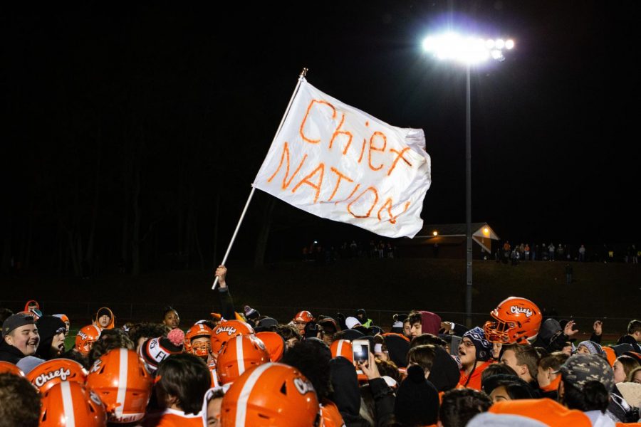 A Chief Nation flag flies as players and fans celebrate Cherokee's Central Jersey Group 5 title