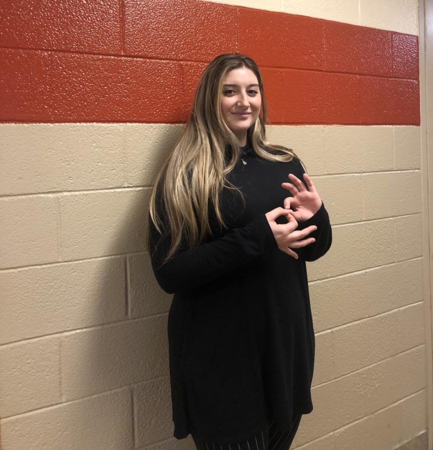 Sign Language Interpreter Ms. Kent uses the sign for "interpret."