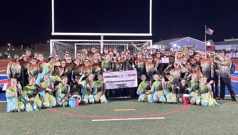 The 2022 Cherokee Marching Band celebrates winning first place at their State Competition. 