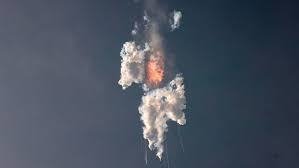 SpaceX's Starship exploding in midair shortly after launch.