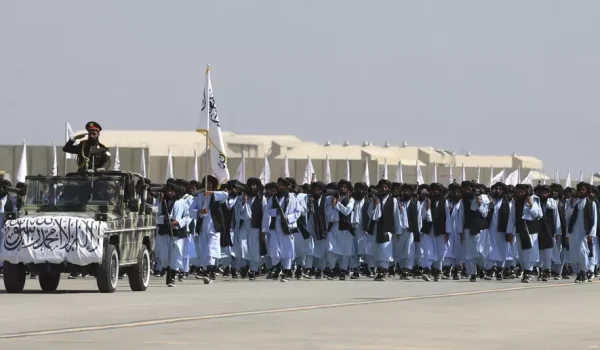 Photo by Siddiqullah Alizai. Taliban fighters march during the third anniversary militia parade marking the withdrawal of US troops from Afghanistan, Bagram Air Base in the Parwan Province of Afghanistan on Aug. 14, 2024.